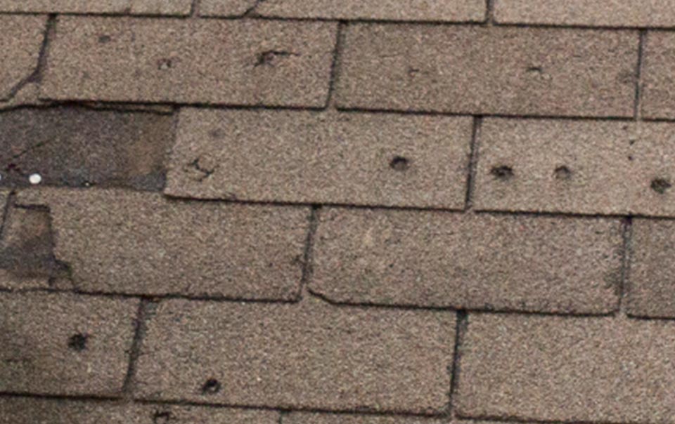 A close up of the roof shingles on a house